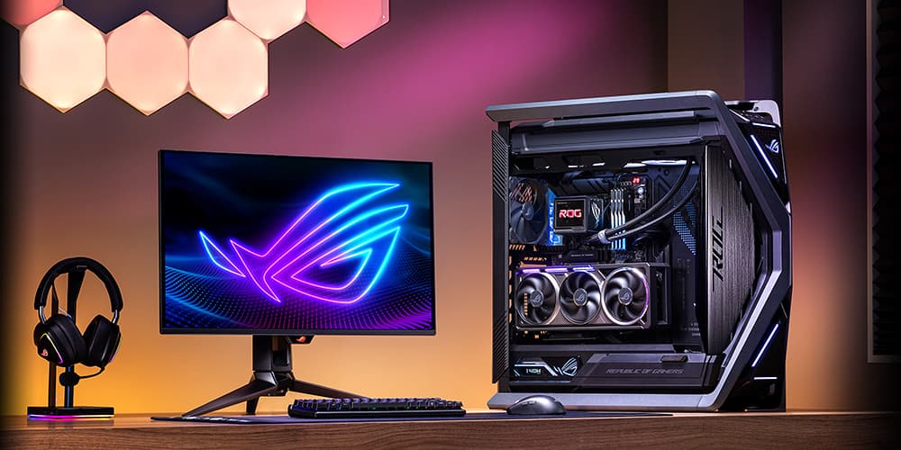 Gaming desk setup with RGB-lit PC, monitor and peripherals synchronized by Aura Sync
